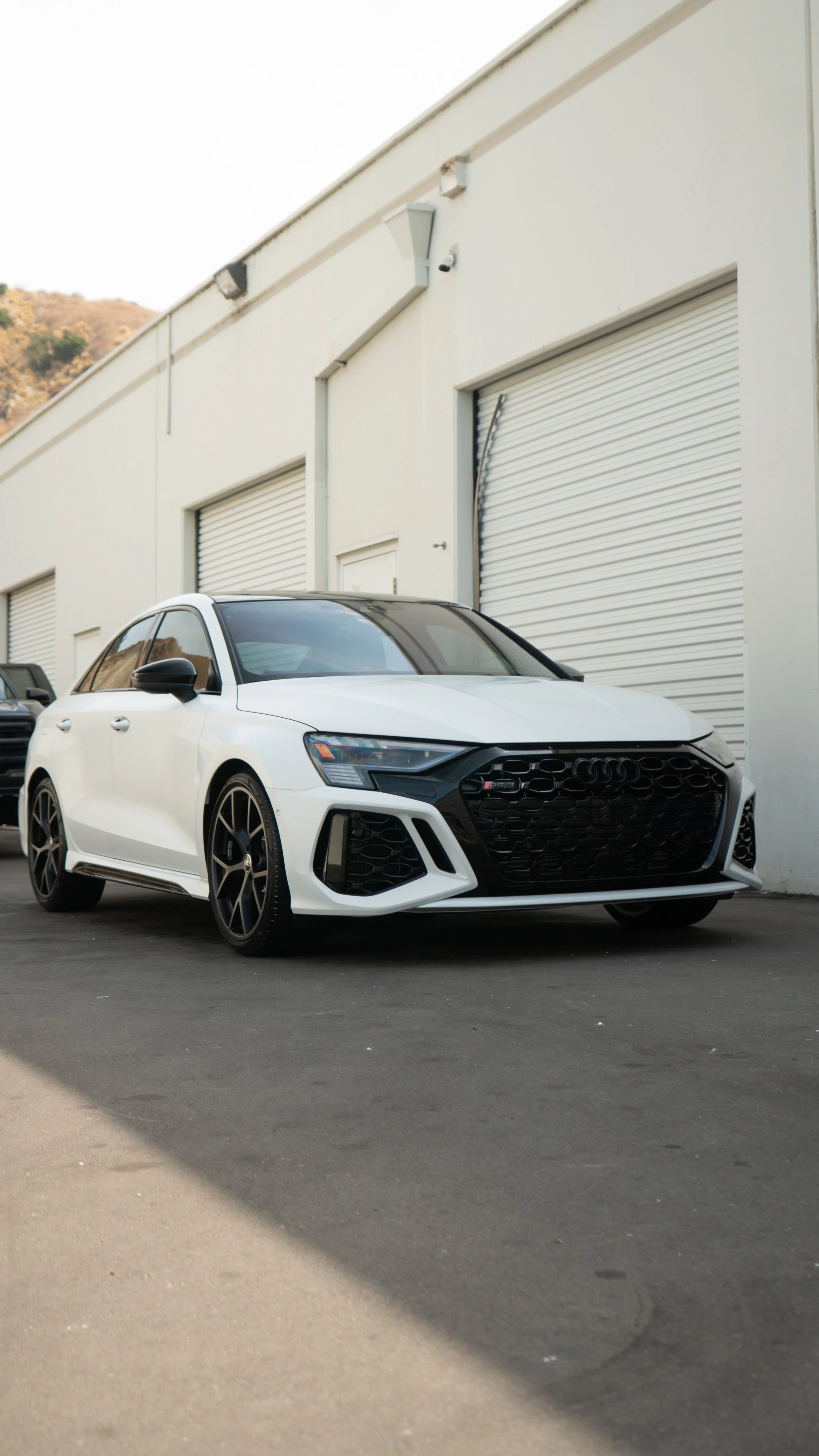 White sedan protected by ceramic coating from NDG Detailing in Orange, CA